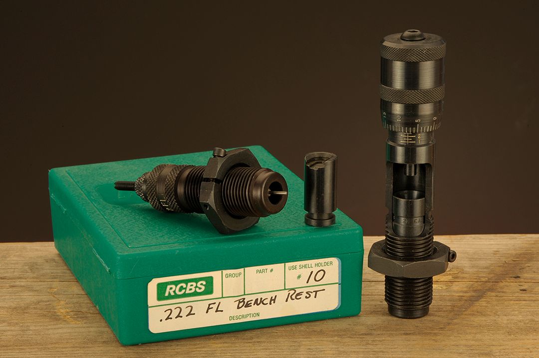 Special dies from the Benchrest Series were used for sizing and seating bullets. The small item is an extended shell holder, which takes up the slack needed when the case and bullet are moved into the upper part of the die.